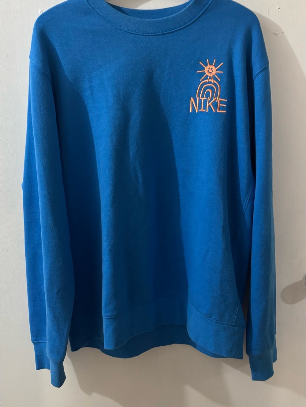 Nike Men’s Bright Blue Crewneck Sweatshirt with Orange Logo